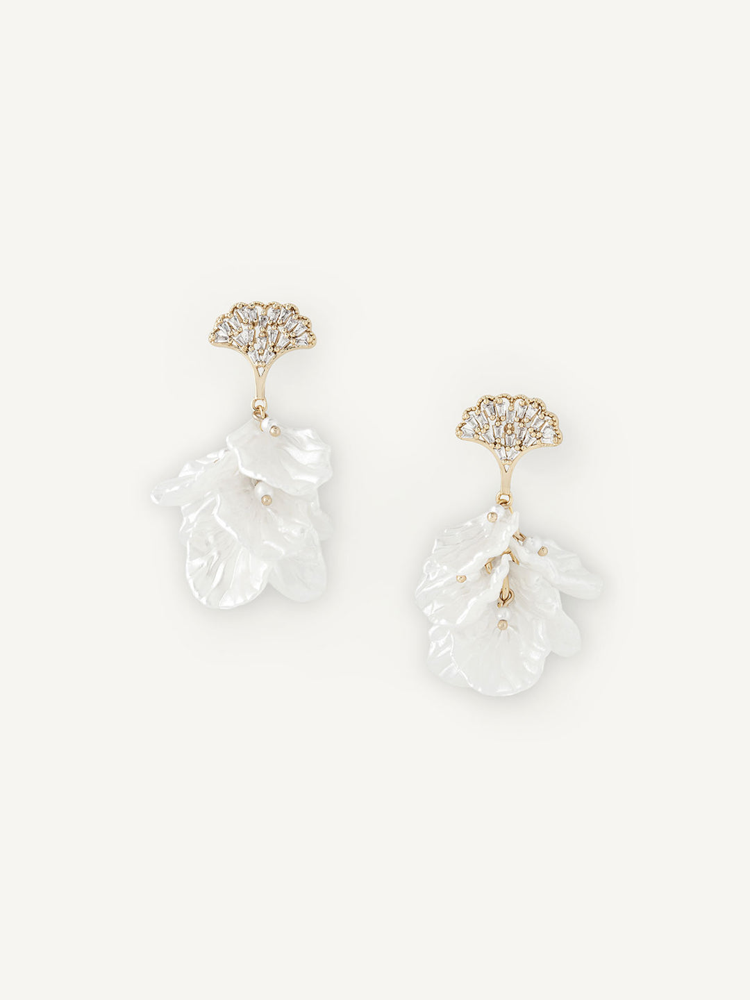 Pair of petal-shaped earrings with gold accents on a white background