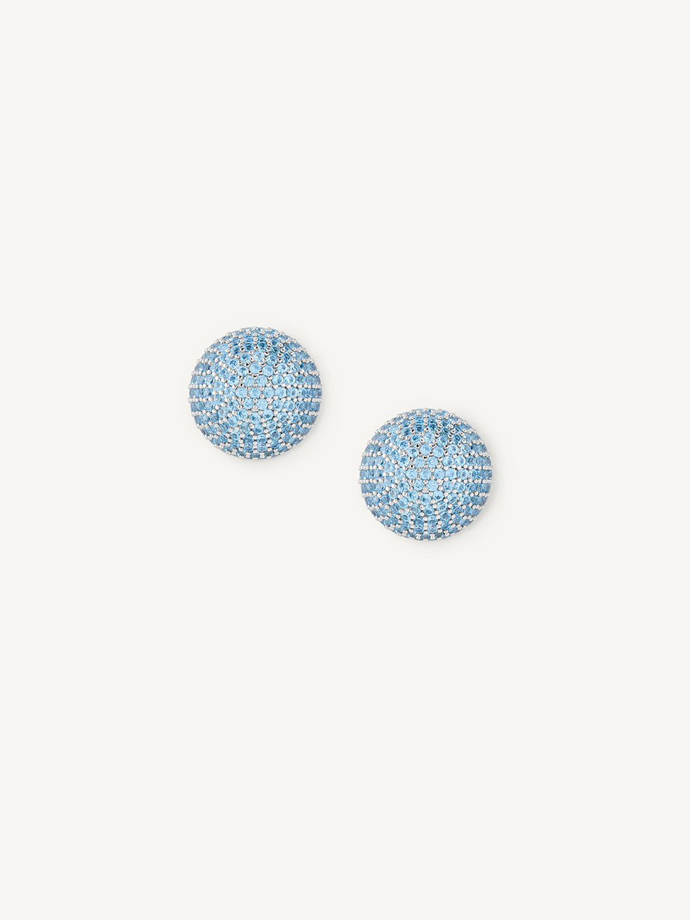 Pair of blue glittery round earrings on a white background