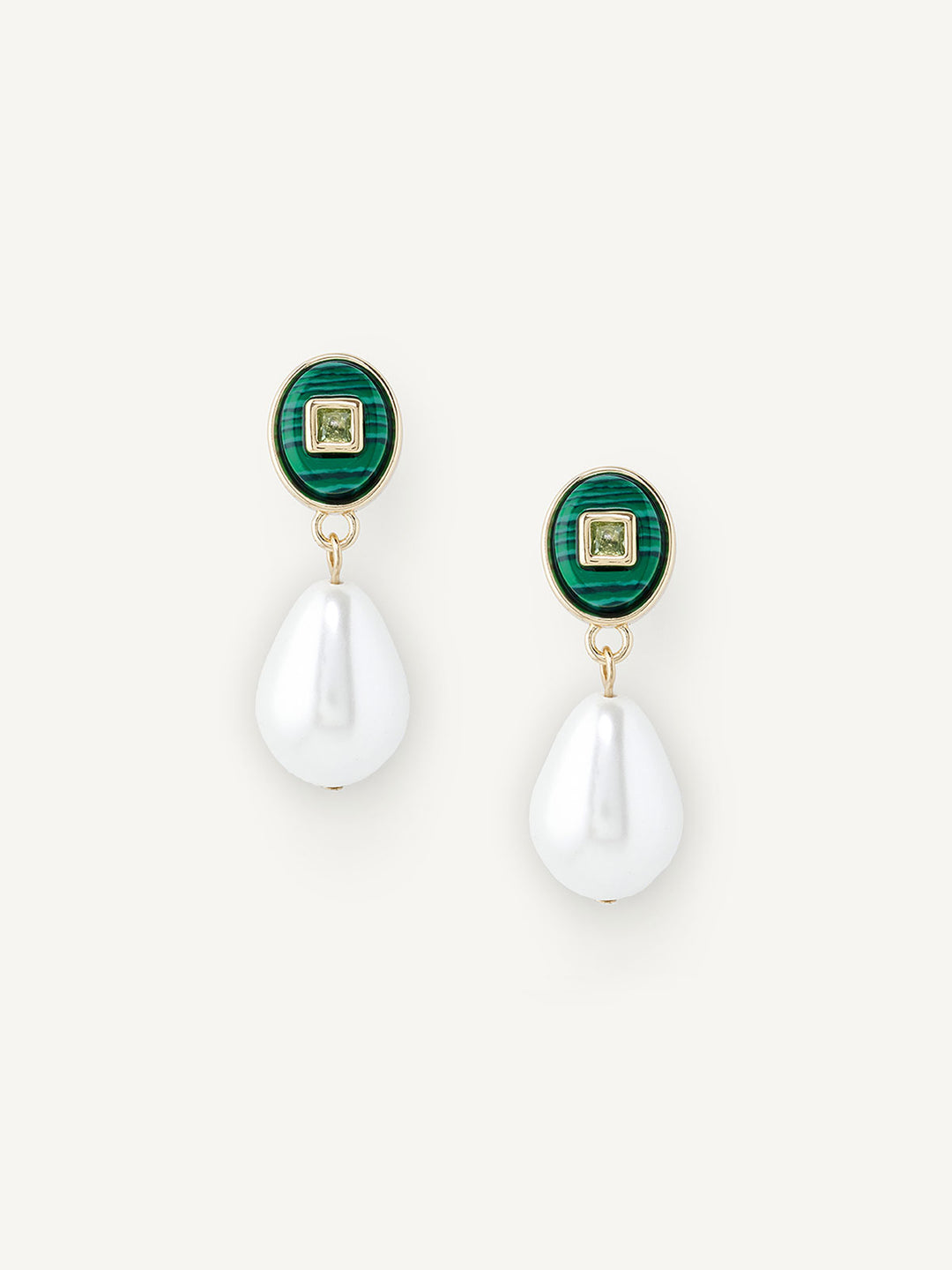 Pair of earrings with green gemstones and white teardrop pendants on a white background