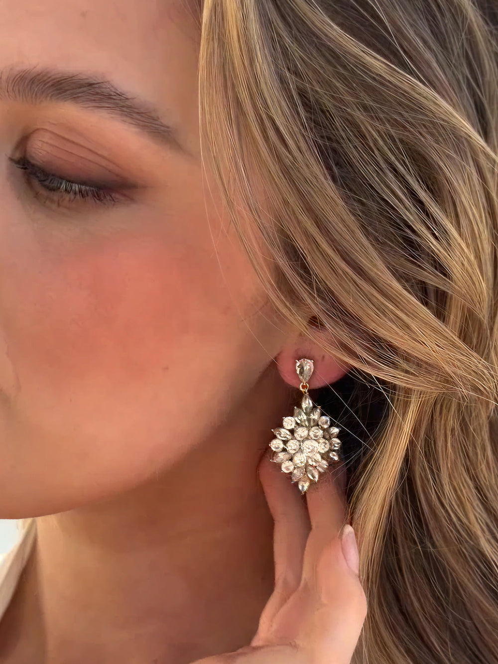 Close-up of a person wearing a decorative earring.