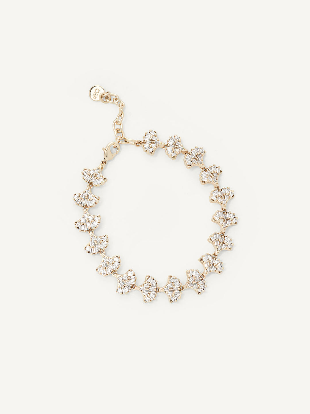Gold bracelet with floral designs on a white background