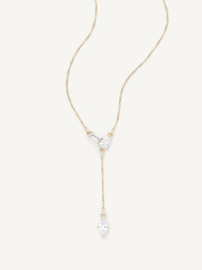 Gold necklace with a teardrop-shaped pendant on a white background