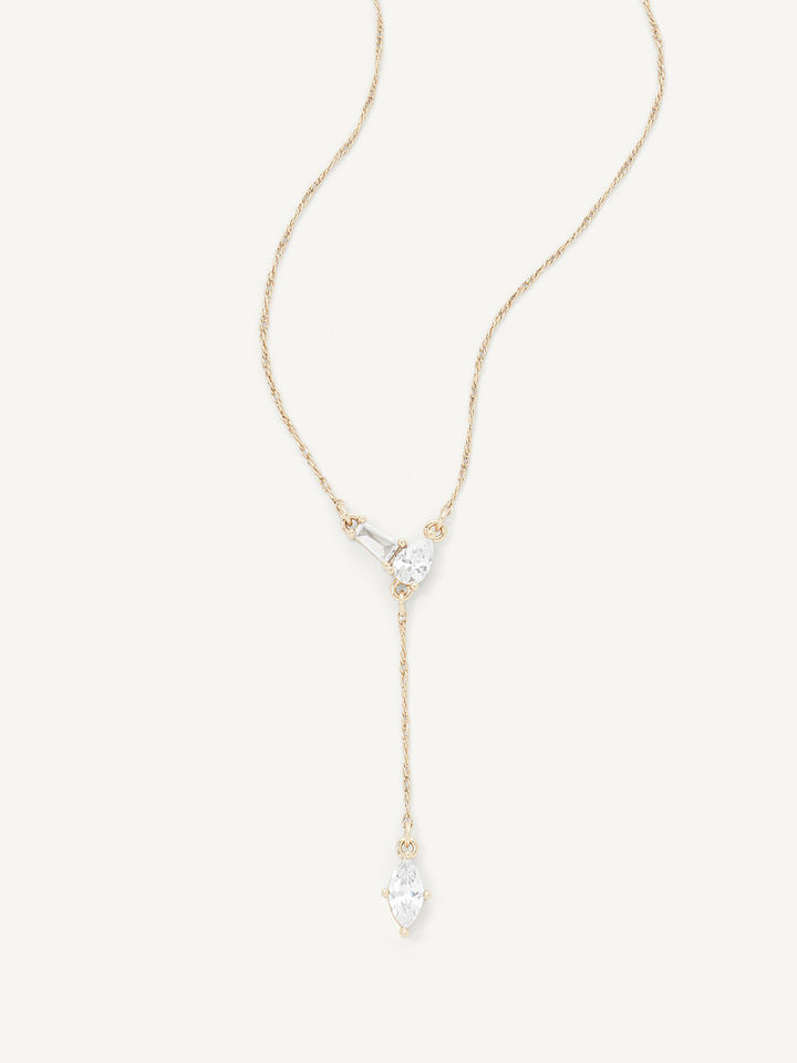 Gold necklace with a teardrop-shaped pendant on a white background