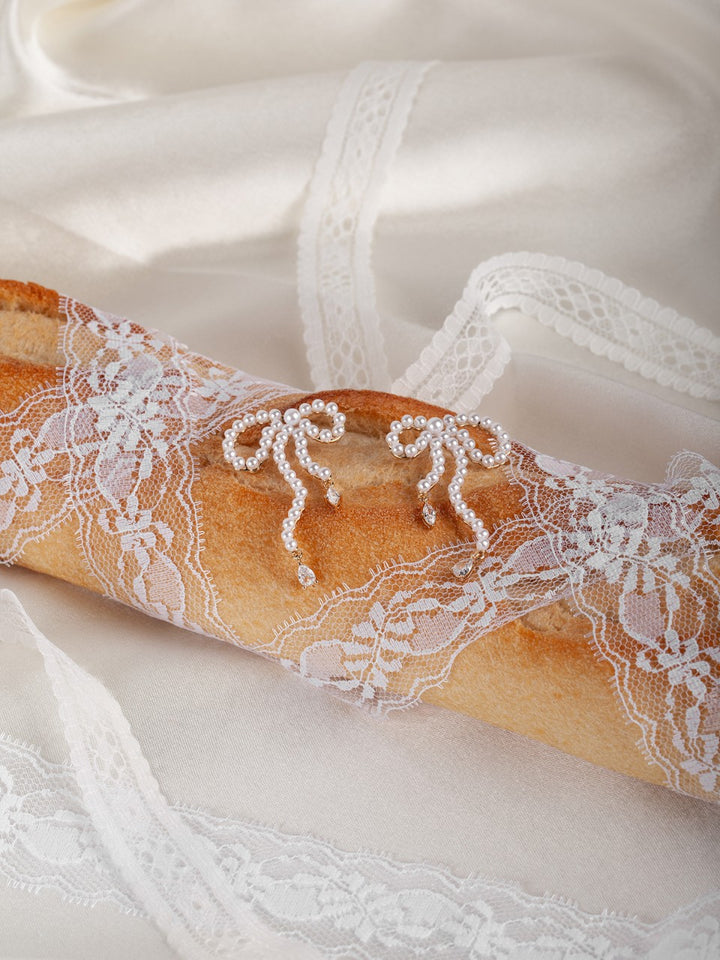 Close-up of a lace-trimmed baguette on a white background