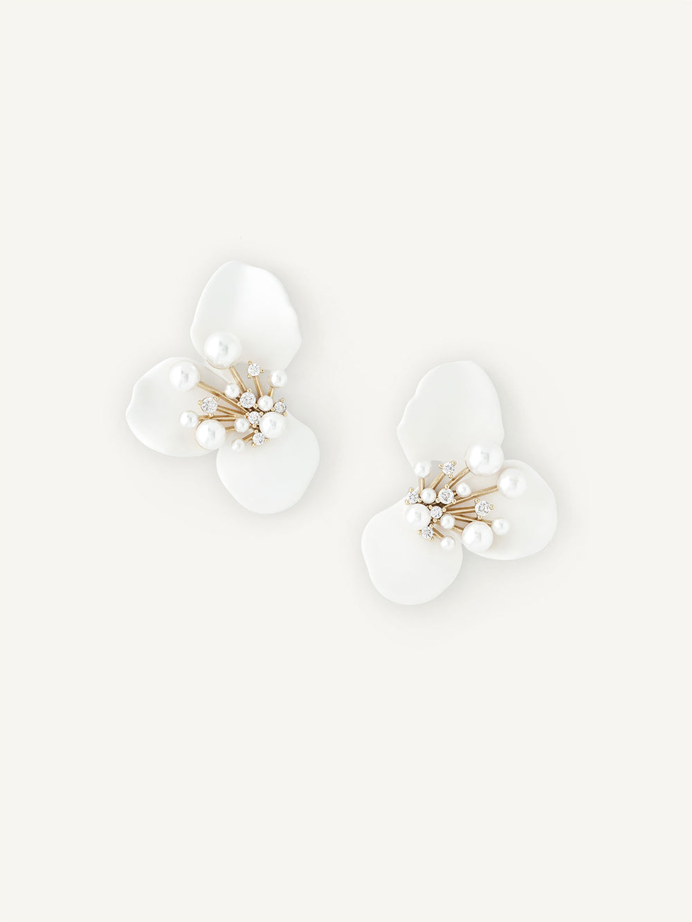 Petal like floral earring with pearl detailing on white background