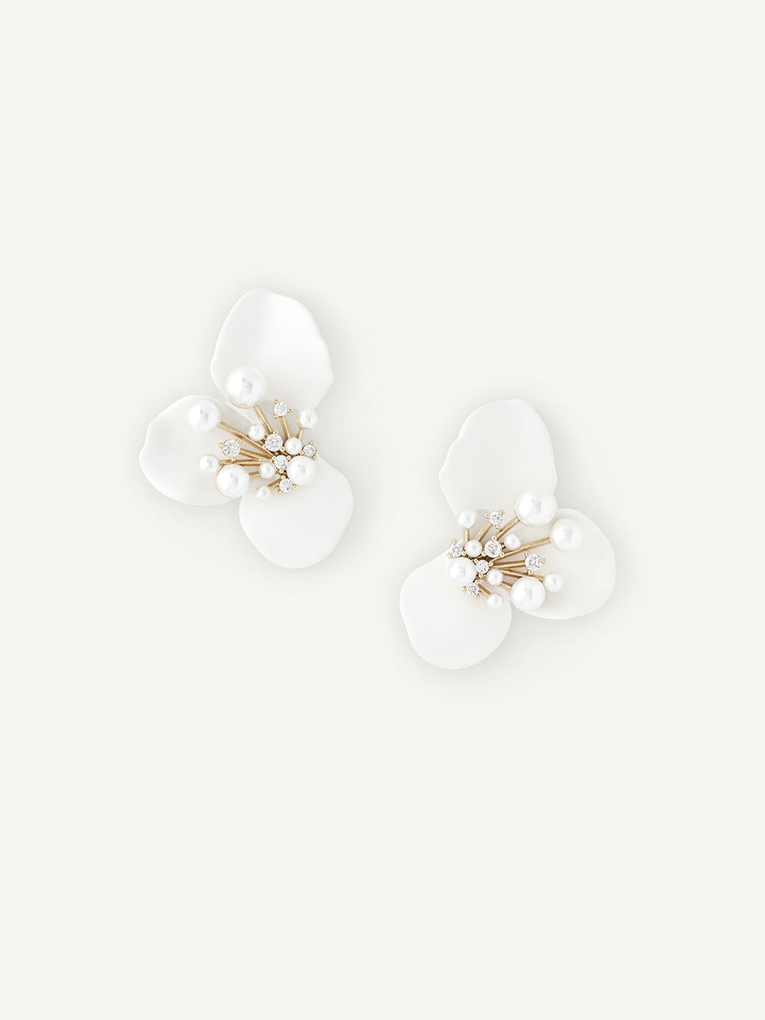Petal like floral earring with pearl detailing on white background